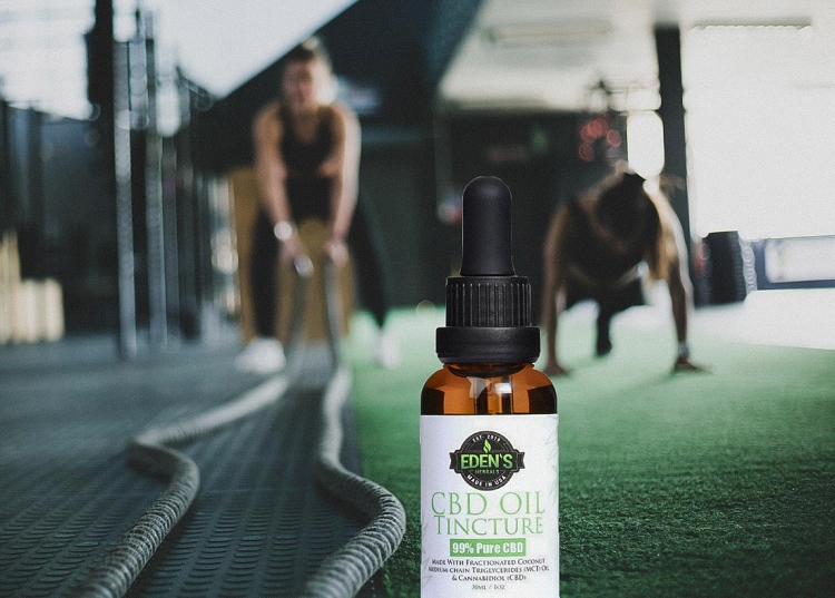 Eden's Herbals CBD Oil Tincture in gym with people working out 